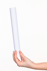 Image showing The cylinder female hands on white background