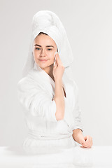 Image showing Woman cleaning face in bathroom