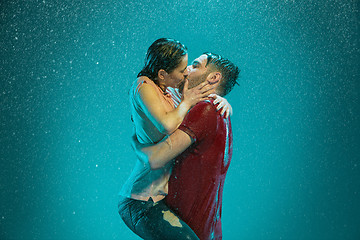 Image showing The loving couple in the rain