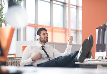 Image showing relaxed young business man at office