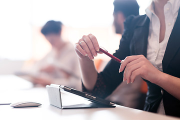 Image showing woman hands holding pen on business meeting