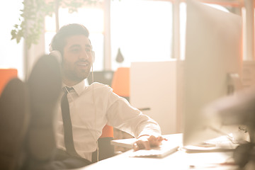 Image showing relaxed young business man at office