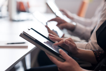 Image showing business people on meeting  using tablet