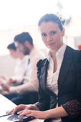 Image showing business woman on meeting  using tablet