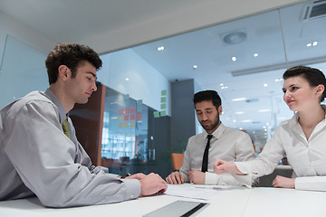 Image showing young couple signing contract documents on partners back