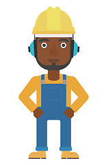 Image showing Man wearing hard hat and headphones 