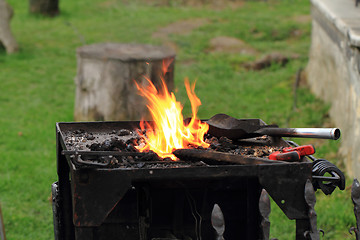 Image showing old smithery and fire