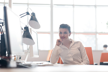 Image showing business woman working on computer at office
