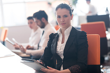 Image showing business woman on meeting  using tablet