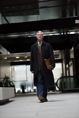 Image showing handsome senior business man walking