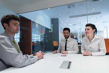 Image showing young couple signing contract documents on partners back