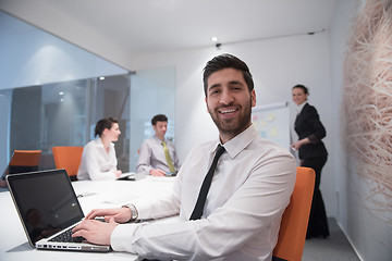 Image showing young business man at meeting