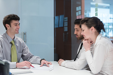 Image showing young couple signing contract documents on partners back