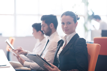 Image showing business woman on meeting  using tablet