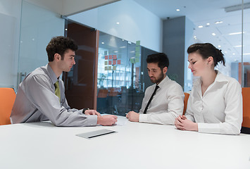 Image showing young couple signing contract documents on partners back