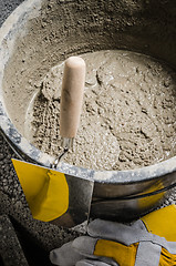 Image showing Tools for bricklayer bucket with a solution and a trowel