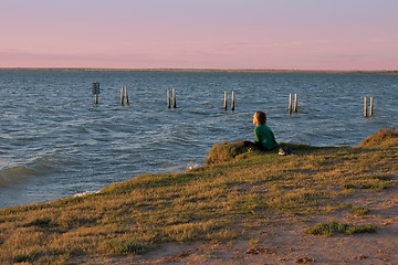 Image showing boy looking over lake