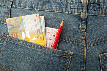 Image showing Swiss money and lottery bet slip in pocket