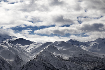 Image showing View on snowy mountains and cloudy sky in evening