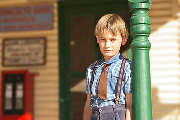 Image showing boy in front of shop