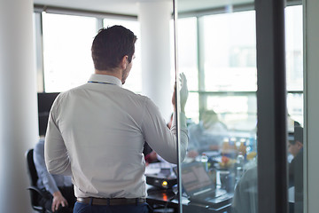 Image showing Business team leader delivering presentation in office.