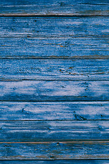 Image showing Old blue cracked paint on wooden background