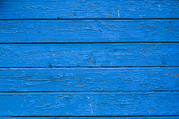 Image showing Old blue cracked paint on wooden background