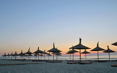 Image showing Silhouettes of parasols.