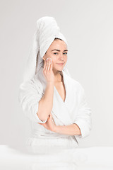 Image showing Woman cleaning face in bathroom