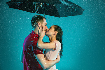 Image showing The loving couple in the rain