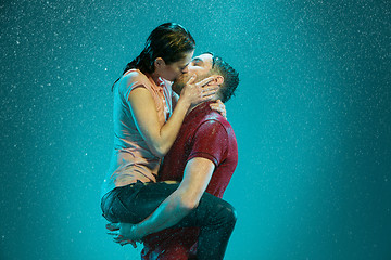 Image showing The loving couple in the rain