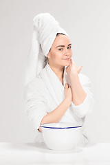 Image showing Woman cleaning face in bathroom