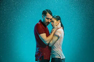 Image showing The loving couple in the rain