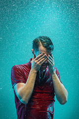 Image showing The portrait of young man in the rain