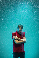 Image showing The portrait of young man in the rain