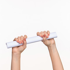 Image showing The cylinder female hands on white background