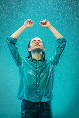 Image showing The portrait of young beautiful woman in the rain