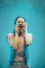 Image showing The portrait of young beautiful woman in the rain