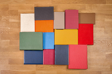 Image showing Old books on wooden floor