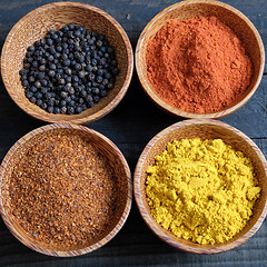 Image showing Colorful spice powder, chilli, pepper, turmeric, cashew 