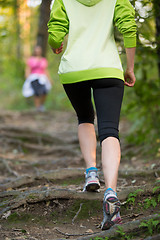 Image showing Female  runner in the forest. 