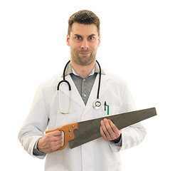 Image showing Crazy doctor is holding a big saw in his hands