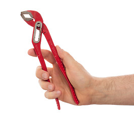 Image showing Hand of male plumber with a red wrench