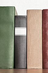 Image showing stack of books on the shelf