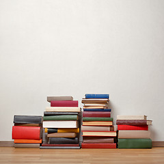 Image showing Old books on wooden floor