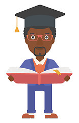 Image showing Man in graduation cap holding book.