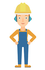 Image showing Woman wearing hard hat and headphones 