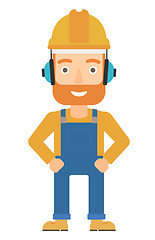 Image showing Man wearing hard hat and headphones 