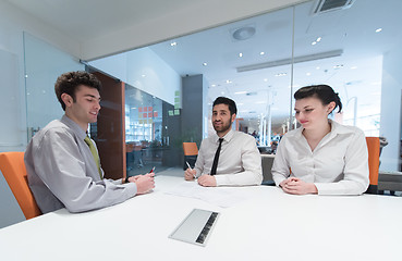 Image showing young couple signing contract documents on partners back