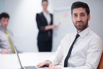 Image showing young business man at meeting